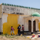 Image for article titled An artist has painted mosques and churches across Kenya yellow to promote peace